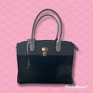 Medium sized shoulder bag by Carpisa. Colors are Black, grey, and off white.